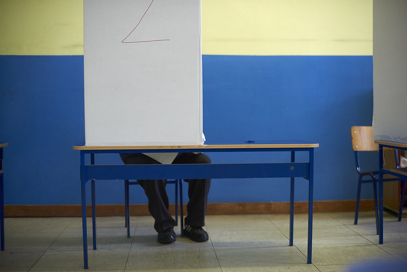 A voter behind a screen in Bosnia and Hezegovina's 2016 general election